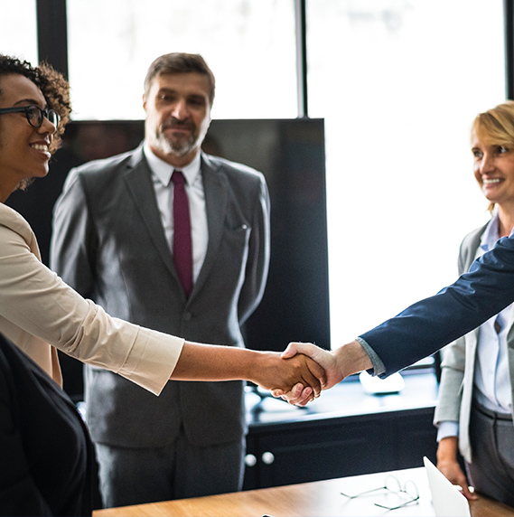 Professional business handshake in a modern office
